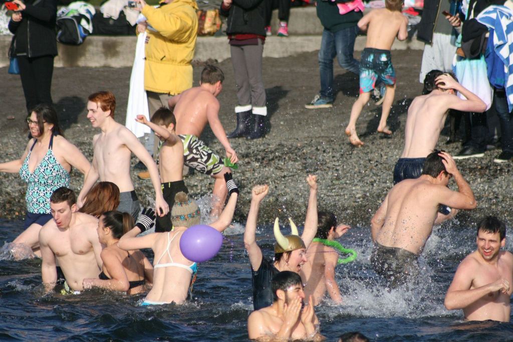 Polar Bear Plunge participants enter Lake Washington at Marina Park in Kirkland. CATHERINE KRUMMEY/Kirkland Reporter