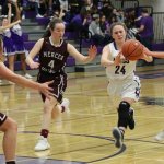 Lake Washington&rsquo;s Sydney Olson attempts to pass away from Mercer Island defenders Claire Mansfield (4) and Jackie Stenberg Friday at Lake Washington High School. Joe Livarchik/Mercer Island Reporter