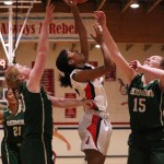 Juanita sophomore Jayla Kidd challenges a handful of Redmond defenders at the rim during Juanita&rsquo;s win over the Mustangs on Jan. 11. JOHN WILLIAM HOWARD/Kirkand Reporter