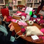 Jennifer Cail (left), Susanna Gilbert and Sabrina Barton participate in a Pussyhat Project event at Serial Knitters in Kirkland. Contributed photo