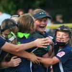 The Kirkland 9/10 All-Star softball team celebrates a perfect game by pitcher Kaya Aldrich in the district tournament last summer at Everest Park in Kirkland. The Kirkland team went on to win the 9/10 softball state championship. Reporter file photo
