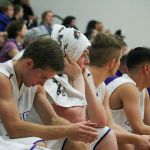 Lake Washington&rsquo;s AJ Filan, left, and Griffin Barker, second left, watch from the bench as the final few minutes of Friday&rsquo;s conference loss to Bellevue play out. JOHN WILLIAM HOWARD/Kirkland Reporter