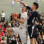 Lake Washington junior Beau Heimdahl challenges Juanita&rsquo;s Cameron Knowles in the first half of Friday&rsquo;s conference tournament game at Lake Washington High School. Heimdahl led all scorers with 18 points. JOHN WILLIAM HOWARD/Kirkland Reporter