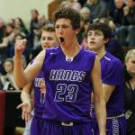 Lake Washington junior Phillip Roe cheers from the bench during overtime of Saturday&rsquo;s 67-63 win over Redmond at Newport High School in Bellevue. JOHN WILLIAM HOWARD/Kirkland Reporter