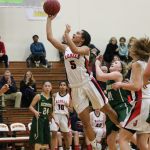 Juanita&rsquo;s Tea Adams slices through the Redmond defense for a layup during the Rebels&rsquo; win over the Mustangs on Feb. 9 at Newport High School in Bellevue. Adams led all scorers with 28 points. JOHN WILLIAM HOWARD/Kirkland Reporter