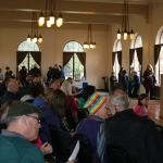 Attendees gather in the St. Edward Seminary dining hall to hear from Daniels Real Estate President Kevin Daniels about the planned changes to the building during an open house on Feb. 11. CATHERINE KRUMMEY/Kenmore Reporter