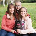 Mason Gordon poses for a photo alongside his mom, Lindsey; his sister, Greta; and their dog, Joey. Contributed photo