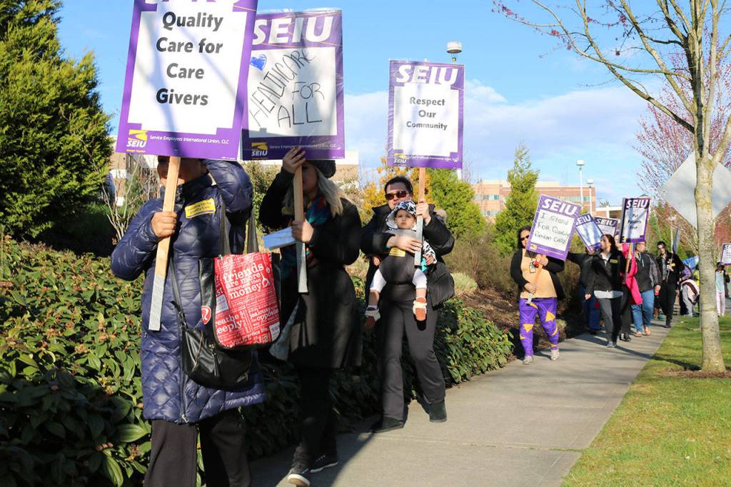 EvergreenHealth employees rally in Kirkland for higher wages, better healthcare