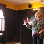 Eunice Hostetter models fashions from Essentials on Park Lane during an American Cancer Society fashion show at Wilde Rover emceed by J.D. Drollinger. CATHERINE KRUMMEY/Kirkland Reporter