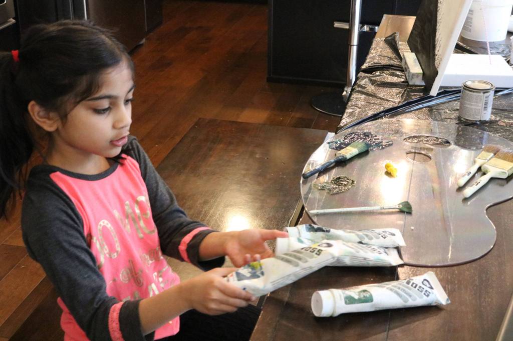 Ira Ganjikunta, 6, talks about the different colors of paint she uses. CATHERINE KRUMMEY / Kirkland Reporter