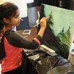 Ira Ganjikunta, 6, works on a painting at her Redmond home. CATHERINE KRUMMEY/Kirkland Reporter