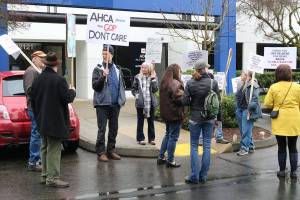 Locals participate in a Indivisible North Seattle-organized rally outside of 1st Congressional District Rep. Suzan DelBene&rsquo;s Bothell office. They wanted to show support for DelBene in her opposition to the Republican-proposed health care reforms in the U.S. House of Representatives. CATHERINE KRUMMEY / Bothell Reporter