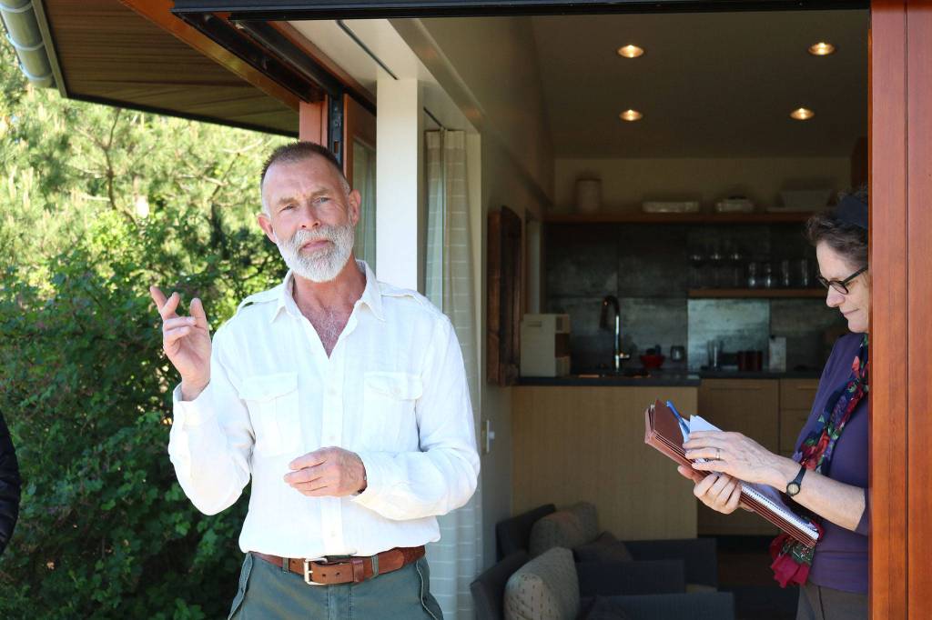 Designer Paul Broadhurst speaks as Washington Sea Grant Coastal Management Specialist Nicole Faghin listens during an event at the Bendich residence. CATHERINE KRUMMEY / Kirkland Reporter