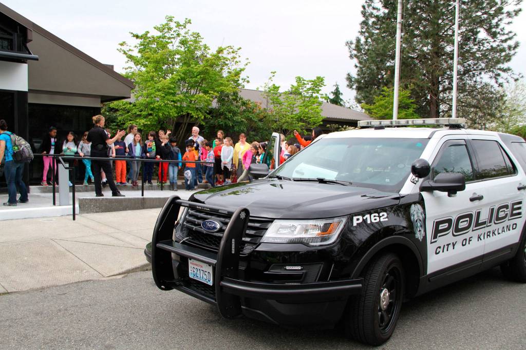Ben Franklin Elementary School second graders learn about being a Kirkland police officer outside of Kirkland City Hall. Contributed photo