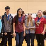 Impending Loom team members Madelyn Colantes, Adam Chen, Laura Chen, Ronya Strom, Claire Whiteside and Eric Gery pose for a photo after a competition. Courtesy photo