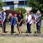 Lake Washington School District Board Vice President Siri Biesner, Kirkland City Councilmember Jon Pascal, LWSD Superintendent Dr. Traci Pierce, Kirkland Mayor Amy Walen, LWSD Board Member Nancy Bernard, LWSD Board Member Mark Stuart and City Councilmember Penny Sweet participate in a groundbreaking ceremony at Juanita High School. CATHERINE KRUMMEY / Kirkland Reporter