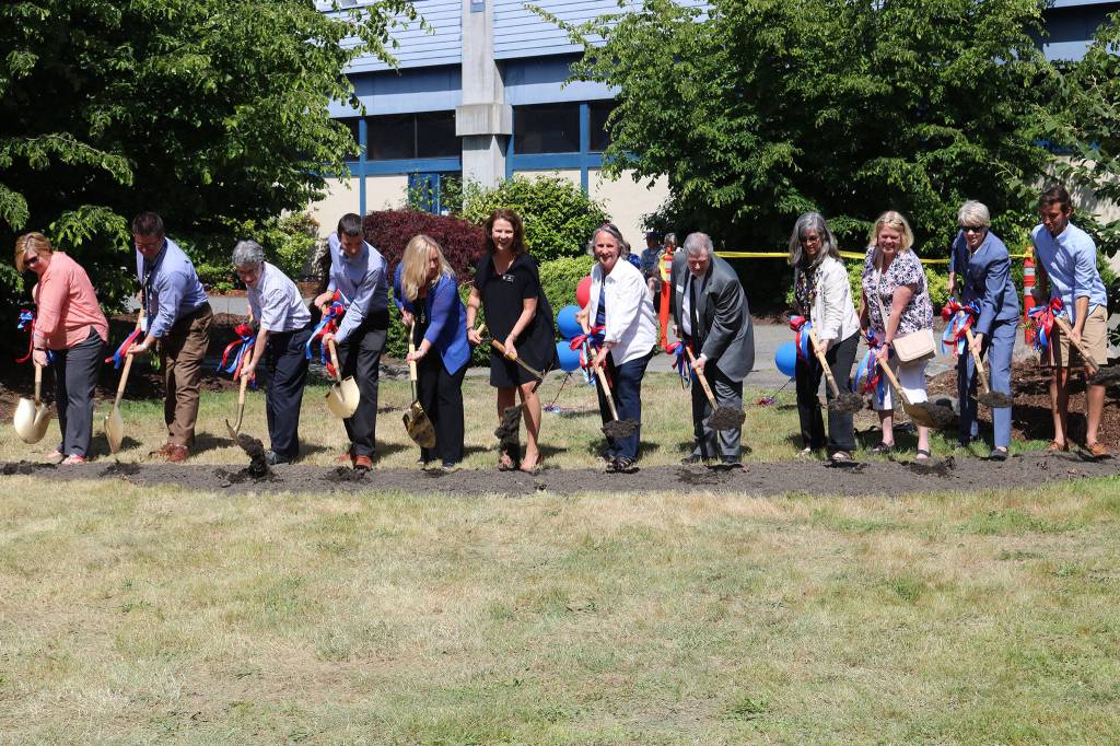 Juanita High School, Lake Washington School District and Juanita High School officials participate in a groundbreaking ceremony at the school. CATHERINE KRUMMEY / Kirkland Reporter