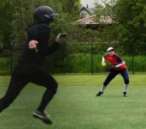 Juanita&rsquo;s Brynn Radke, an all-league first-teamer at second base, throws a runner out at first. Courtesy of Gayle Richardson