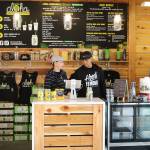 Kirkland Wow Wow Hawaiian Lemonade owners Julianne and Terrence Santos chat after helping some customers. CATHERINE KRUMMEY, Kirkland Reporter