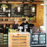 Kirkland Wow Wow Hawaiian Lemonade owners Julianne and Terrence Santos chat after helping some customers. CATHERINE KRUMMEY, Kirkland Reporter
