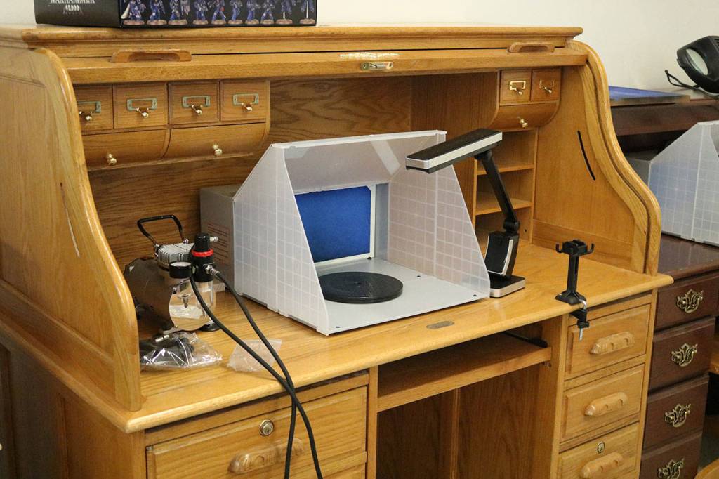 Games & Gizmos has airbrush stations available for customers who want to customize pieces of their games. CATHERINE KRUMMEY / Kirkland Reporter