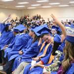 Graduates from the Lake Washington Technical Academy in Kirkland wave and acknowledge their family and friends who have supported them in their educational careers. Samantha Pak, Kirkland Reporter
