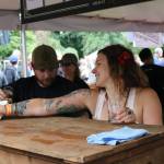 Karen Troy, taproom manager for Black Raven Brewing in Redmond, staffs the kiosk during last weekend&rsquo;s Washington Brewers Festival at Marymoor Park. Aaron Kunkler, Reporter Newspapers