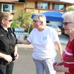 Kirkland Police Chief Cherie Harris speaks to Kirkland residents Linda and Lucille Funk at a community cookout during National Night Out. Megan Campbell, Kirkland Reporter