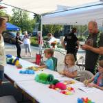 Community members gathered for a barbecue in the 13600 block of 116th Avenue Northeast for National Night Out Tuesday. Megan Campbell/staff photo