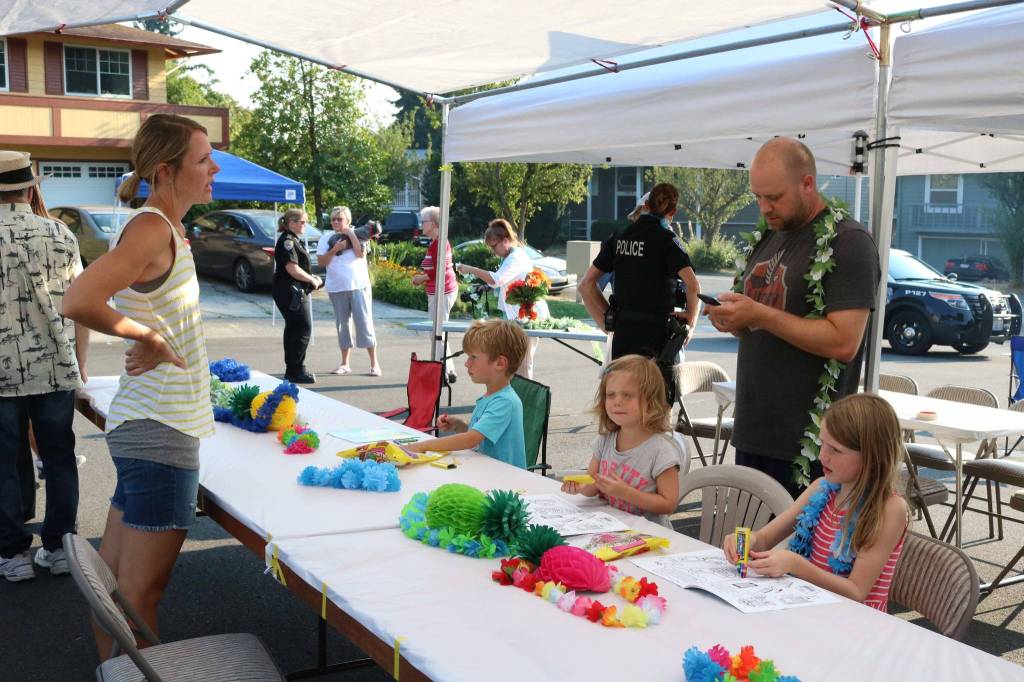Community members gathered for a barbecue in the 13600 block of 116th Avenue Northeast for National Night Out Tuesday. Megan Campbell/staff photo