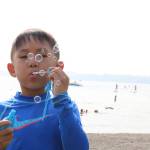 Mason Myung, 5, blows bubbles during Kirkland&rsquo;s Summerfest Aug. 11. Megan Campbell/staff photo