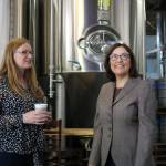 Congresswoman Suzan DelBene, right, tours the Postdoc Brewing facility in Redmond with co-owner Debbie Chambers on Tuesday. Andy Nystrom, Redmond Reporter