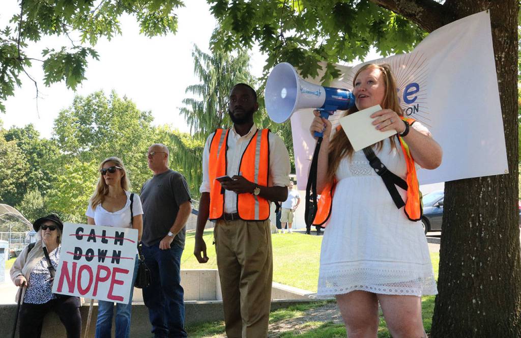 Morgan Steele (right) addresses the crowd at Everest Park in Kirkland. Samantha Pak, Kirkland Reporter