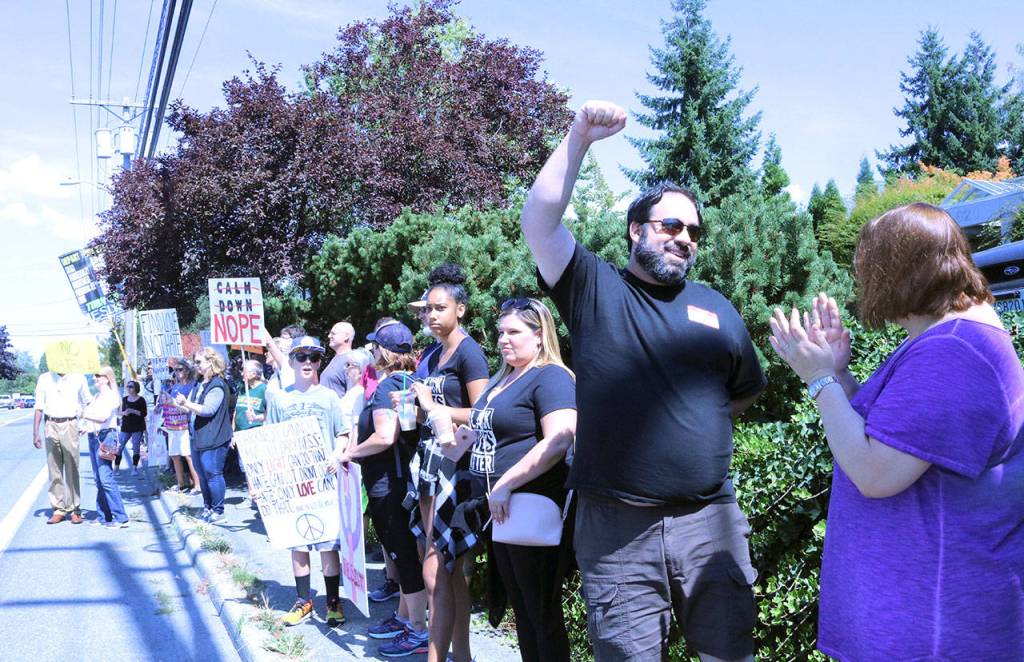 Demonstrators on the sidewalk across the street from Google in Kirkland. Samantha Pak, Kirkland Reporter