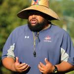 Juanita High head coach Lele Te&rsquo;o encourages his players during a recent practice. Andy Nystrom, Kirkland Reporter