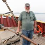 Bob Nelson, captain of the Lady Washington, stands at the tiller, which is made of purple heart wood and connected directly to the rutter. Megan Campbell/Kirkland Reporter