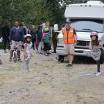 Arden Mehta, 8, right, tosses a horseshoe during the &ldquo;Crossing Kirkland&rdquo; event Saturday. Megan Campbell/Kirkland Reporter