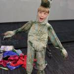 Ciaran Lewbel, 8, rawrs like a dinosaur during the costume swap Saturday. Megan Campbell/Kirkland Reporter