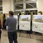 A Kirkland resident speaks with Michael Cogle, deputy director of parks for the city, about plans for the picnic pavillion at Juanita Beach Park. Kailan Manandic, Kirkland Reporter