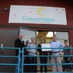 Co-founders James Kidwell and Paul Mullan pose with their staff as they present their BHCOE accreditation certificate. BHCOE accreditation puts Connections Behavior Planning & Intervention in the top 10 percent of ABA therapy providers, according to Mullan.