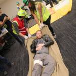CERT members drag an injured man to the medical area during a disaster drill in Kirkland City Hall Nov. 18. Megan Campbell, Kirkland Reporter