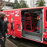 Stacy Edwards, owner of the Eastside GYMGUYZ franchise, opens his van to show the various equipment his trainers use with their clients. Kailan Manandic, Kirkland Reporter