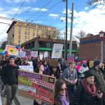 Marchers walk down South Jackson Street in Seattles International District during the Womens March on Seattle. About 175,000 people participated in the event. Samantha Pak, Kirkland Reporter