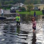 Local residents check out the water buildup near the intersection of 145th Street and 75th Avenue at the Kirkland-Kenmore boundary. Courtesy photo