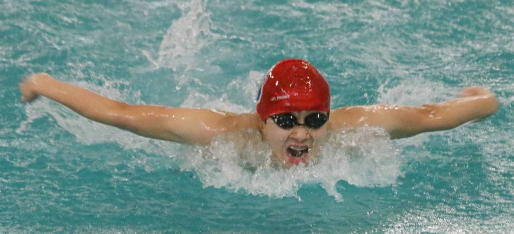 Juanitas Enoch Lee splashes through the butterfly segment of the 200-yard individual medley last week. Andy Nystrom, Kirkland Reporter