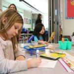From left, Rose Hill Elementary School first graders Brynley Songer, Anna Nguyen and Camilla Briones create Valentines for veterans.Samantha Pak, Kirkland Reporter