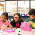 Rep. Suzan DelBene (WA-1) (center) discuss Valentines and veterans with first graders, from left, Diya Karimilla and Namit Jose at Rose Hill Elementary School. Samantha Pak, Kirkland Reporter