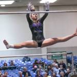 Lake Washingtons Kaysha Walford competes on the bars at state. Courtesy of Willy Paine