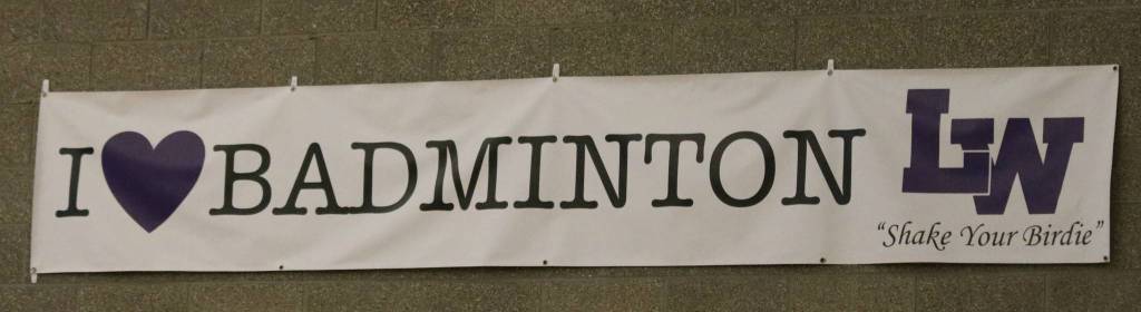 Lake Washington Highs badminton sign on the gym wall. Andy Nystrom, Reporter