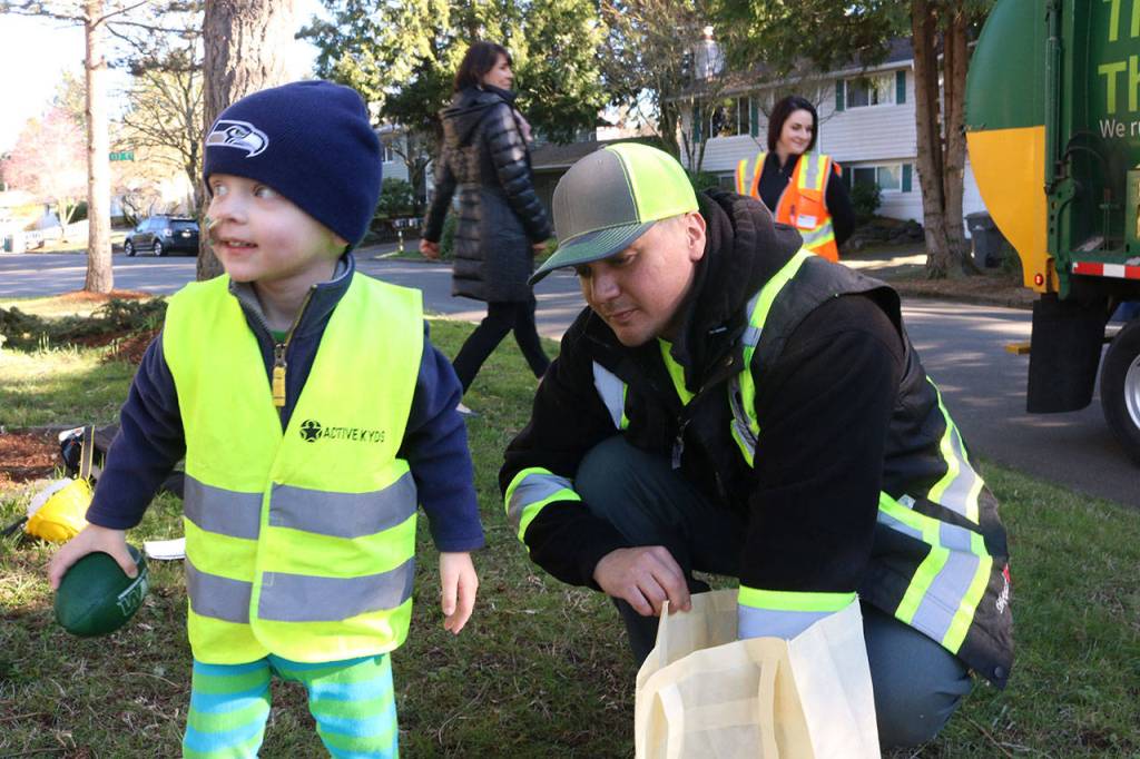 When Waste Management drivers visited 2-year-old Lorne Muller (left) on March 15, they came bearing gifts. Kailan Manandic, staff photo
